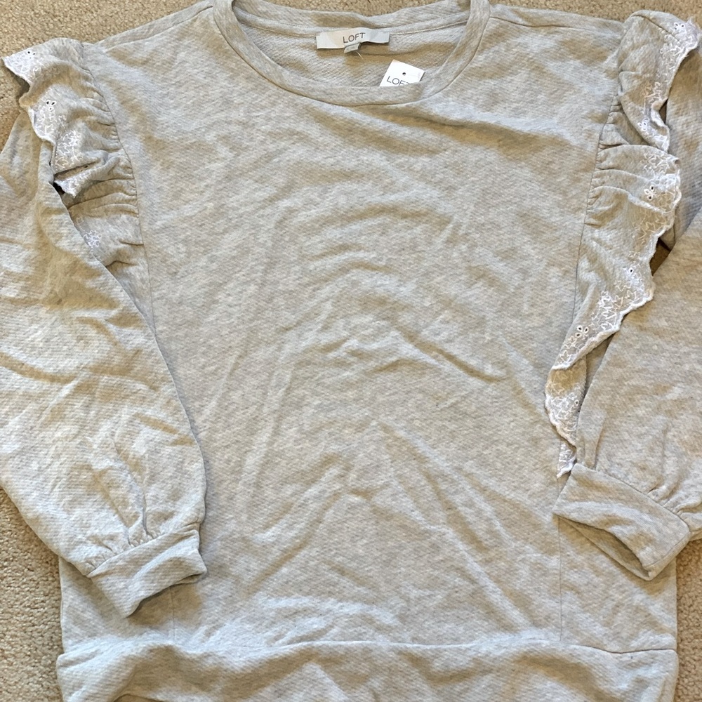 Loft grey ruffle sweatshirt. Never worn .